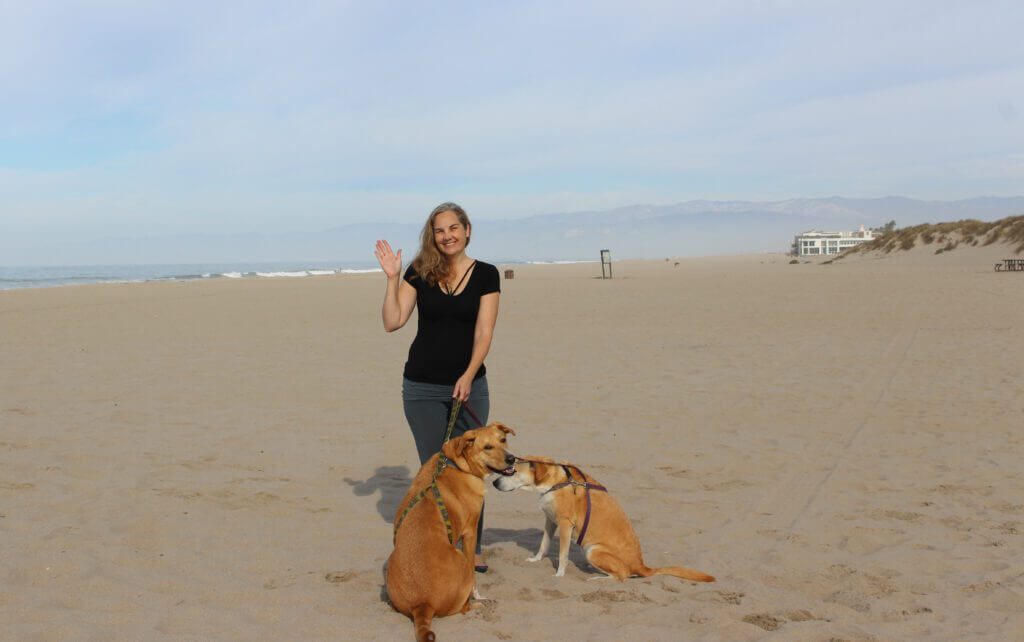women with a dog on beach